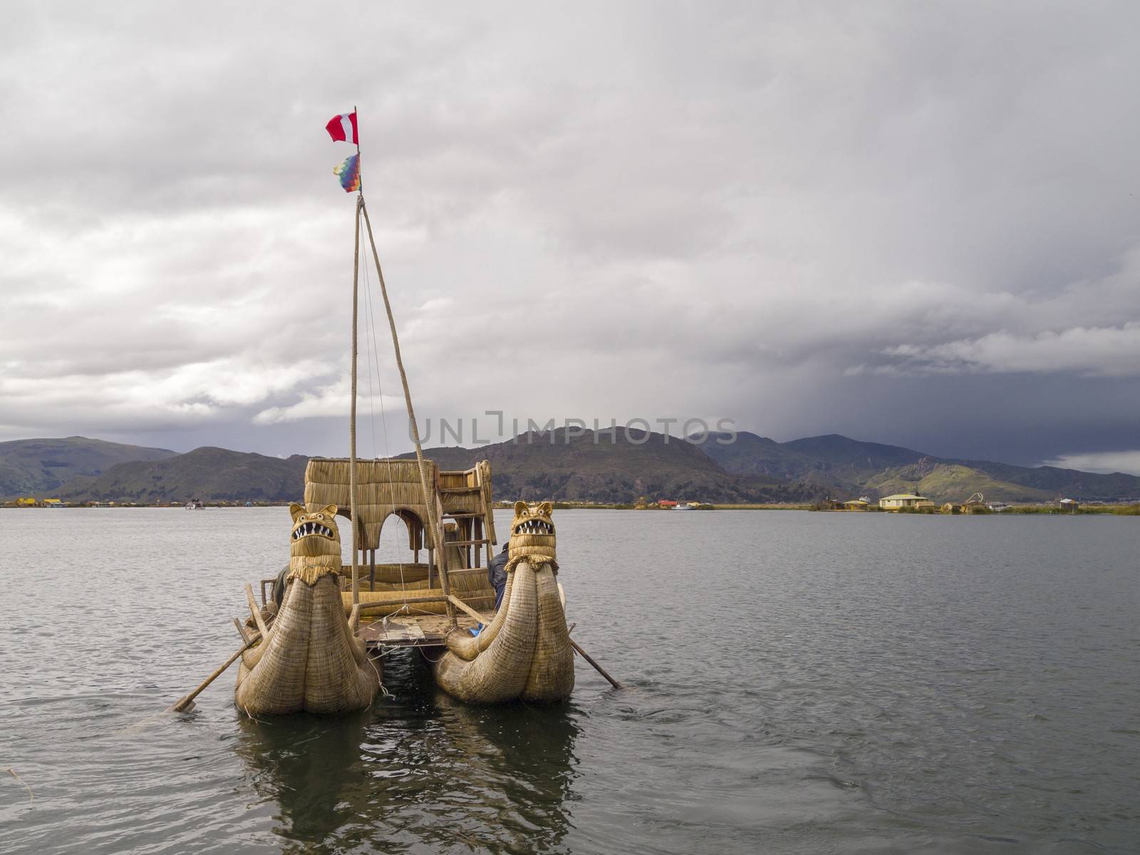 Old traditional floating reed boat in Titicaca lake, Puno, Peru.