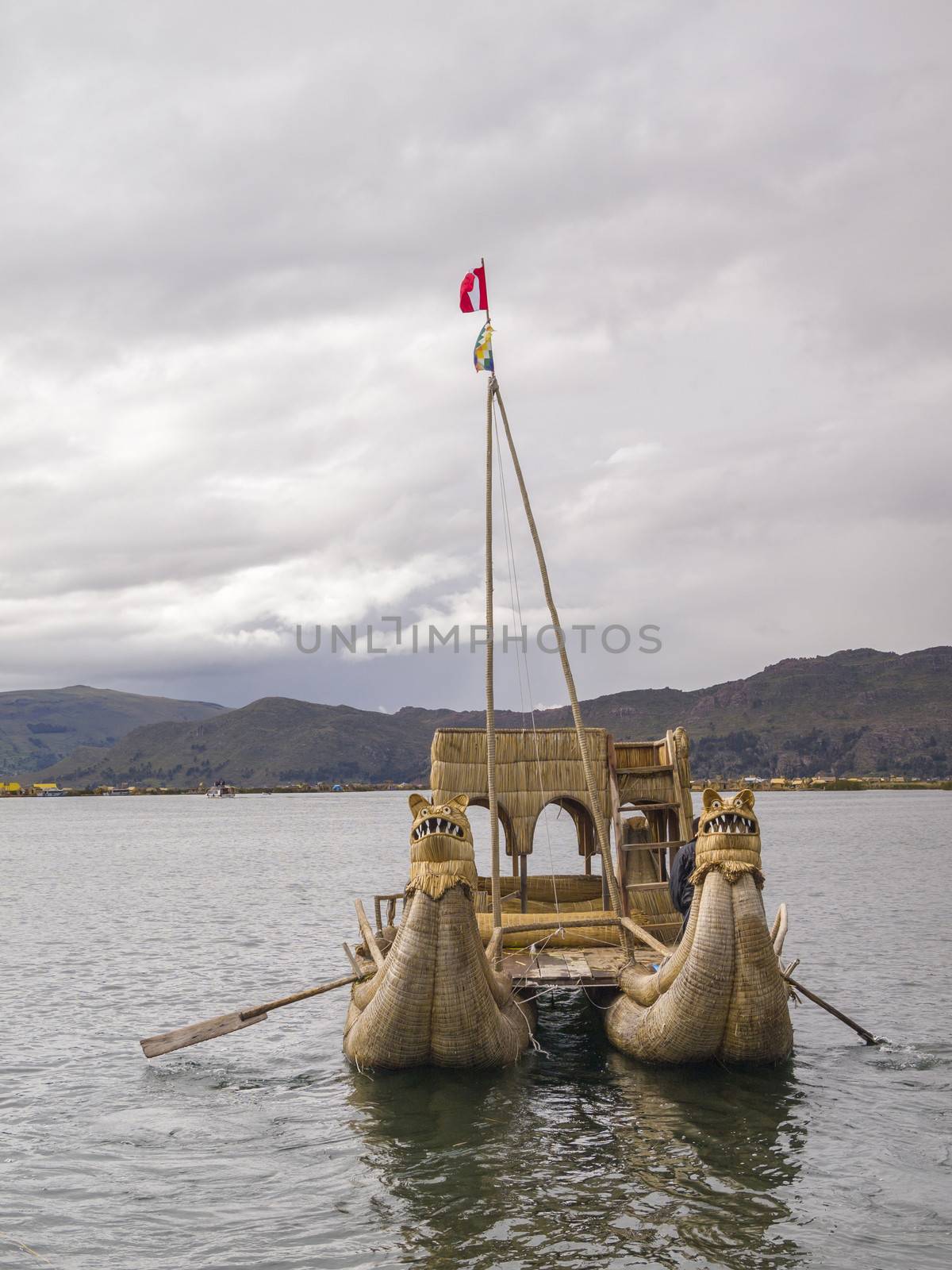 Old traditional floating reed boat in Titicaca lake, Puno, Peru.