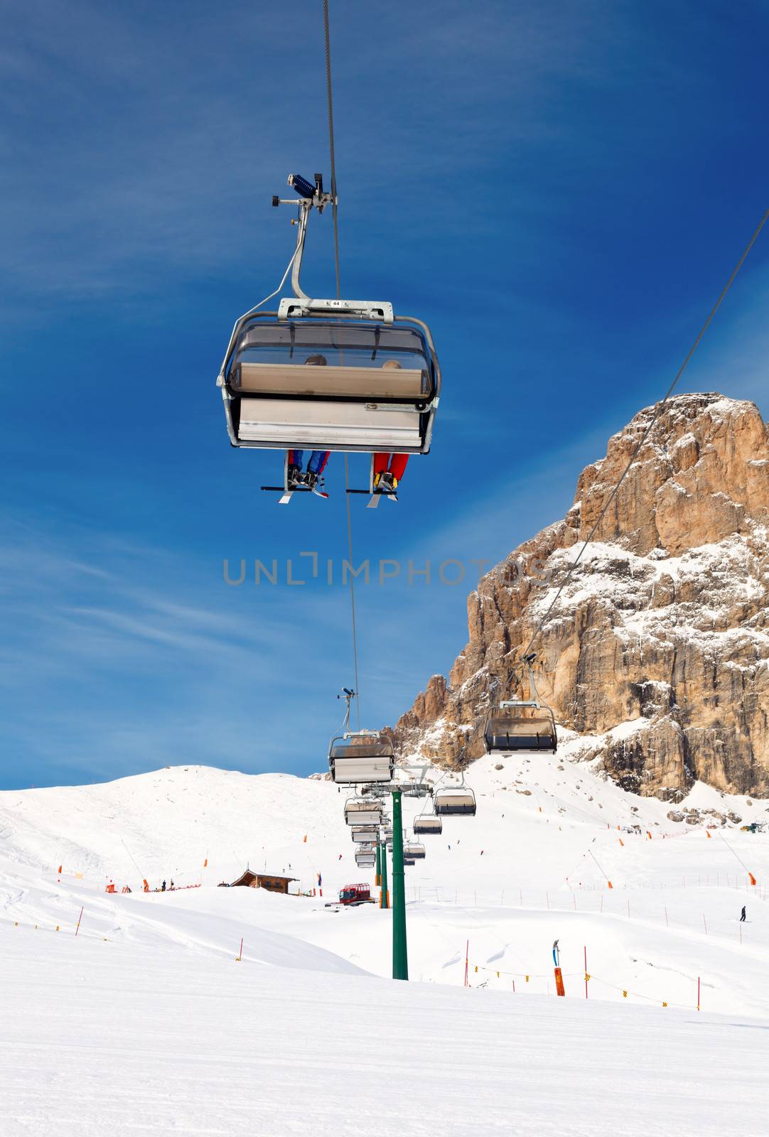Chair lift with skiers at ski resort