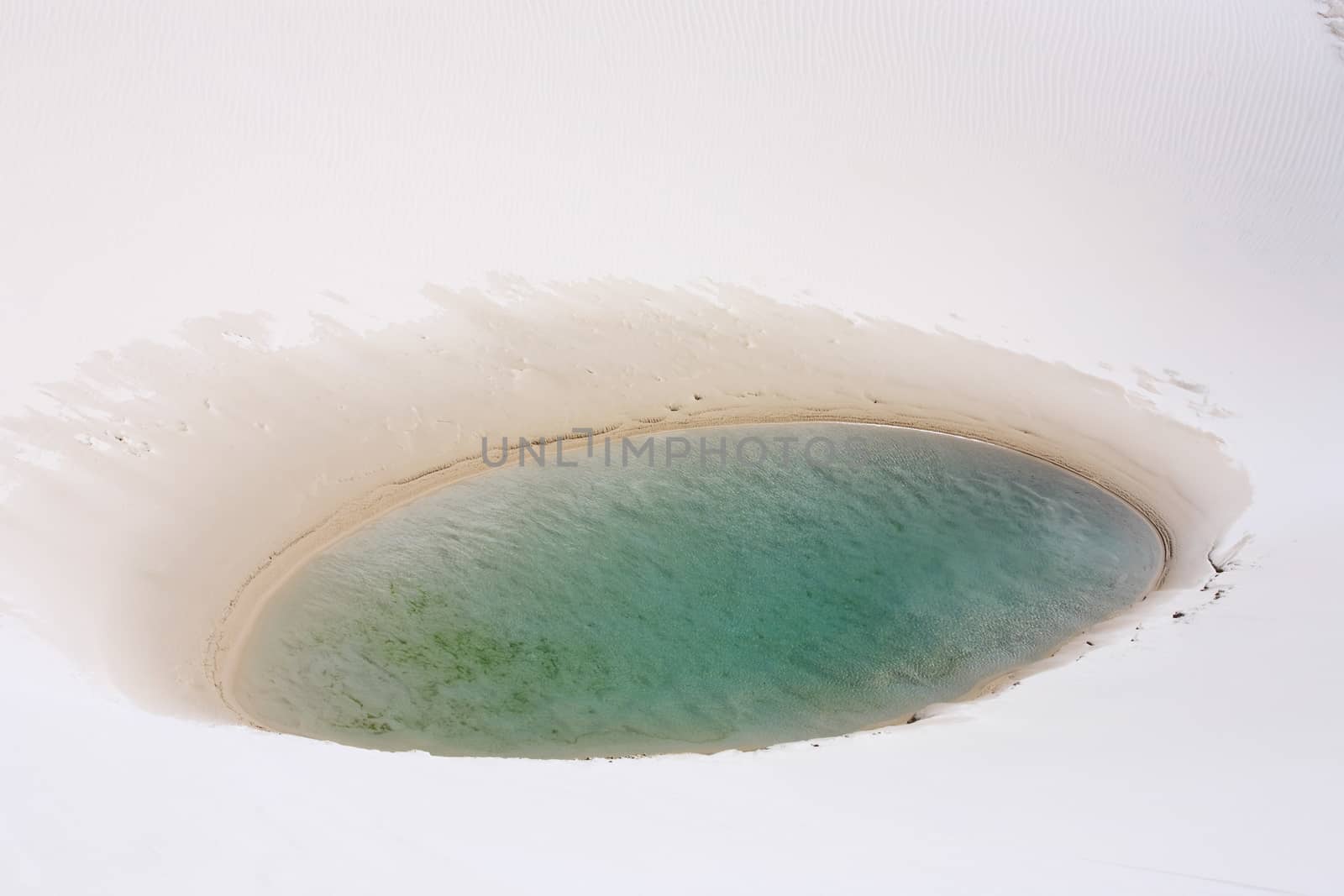 view of lagoa azul in desert sand dunes of the Lencois Maranheses National Park in brazil