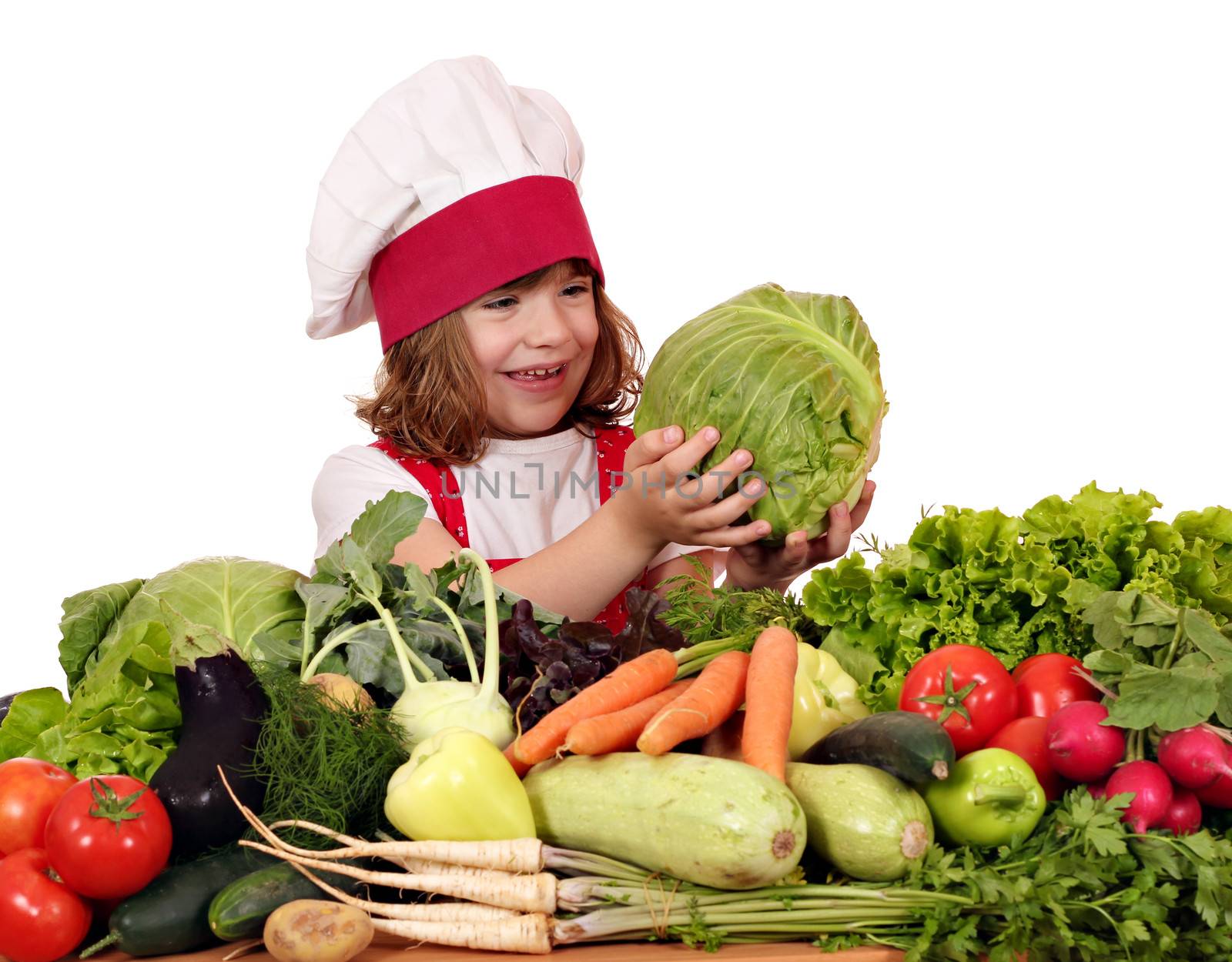 happy little girl cook with vegetables