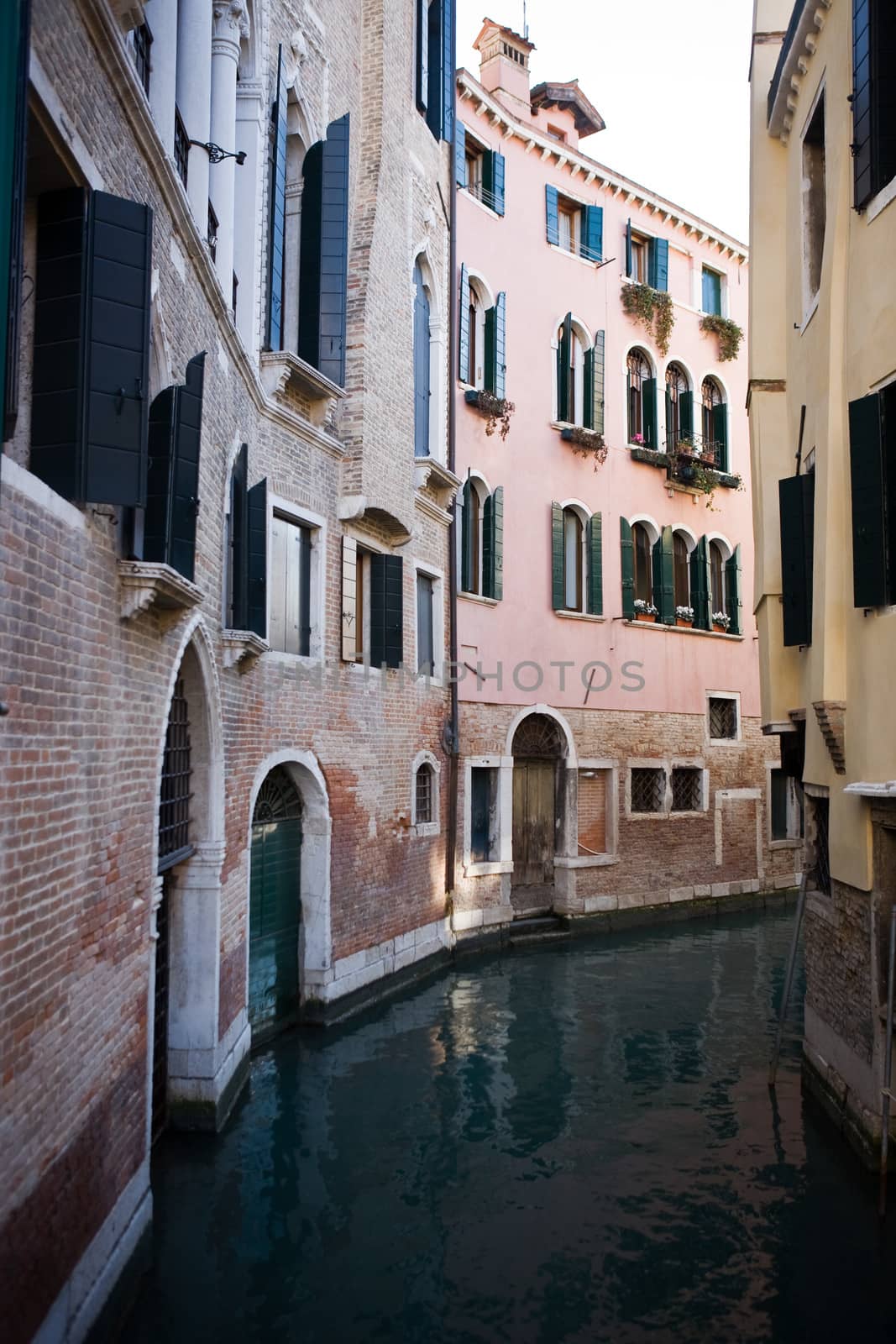 along small canal in the beautiful city of venice in italy