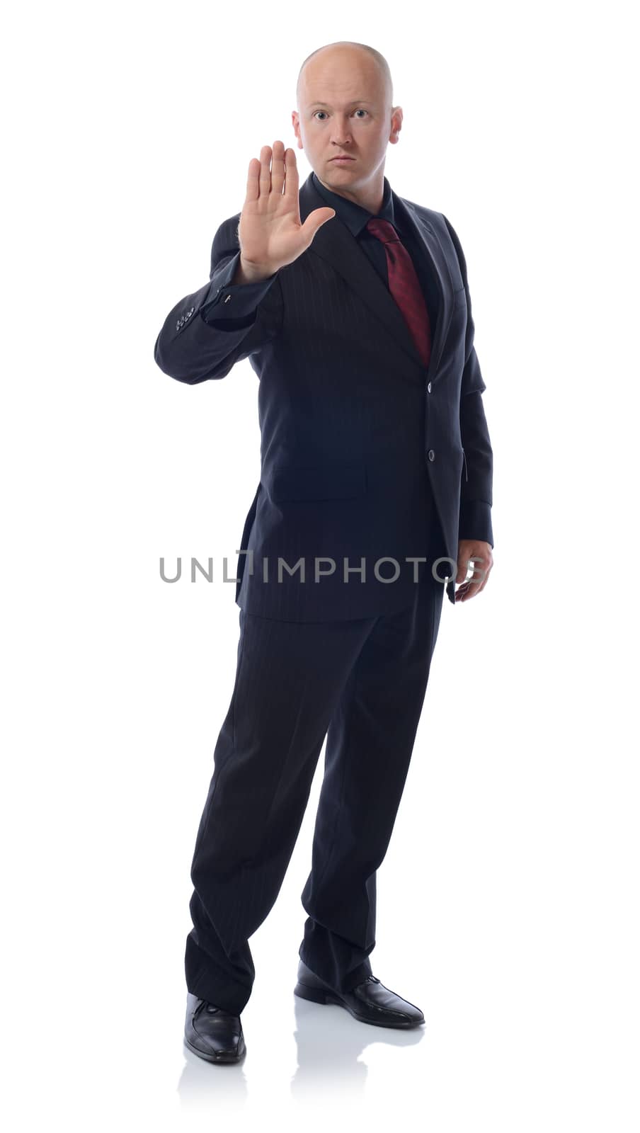 Businessman making stop sign full length isolated on white