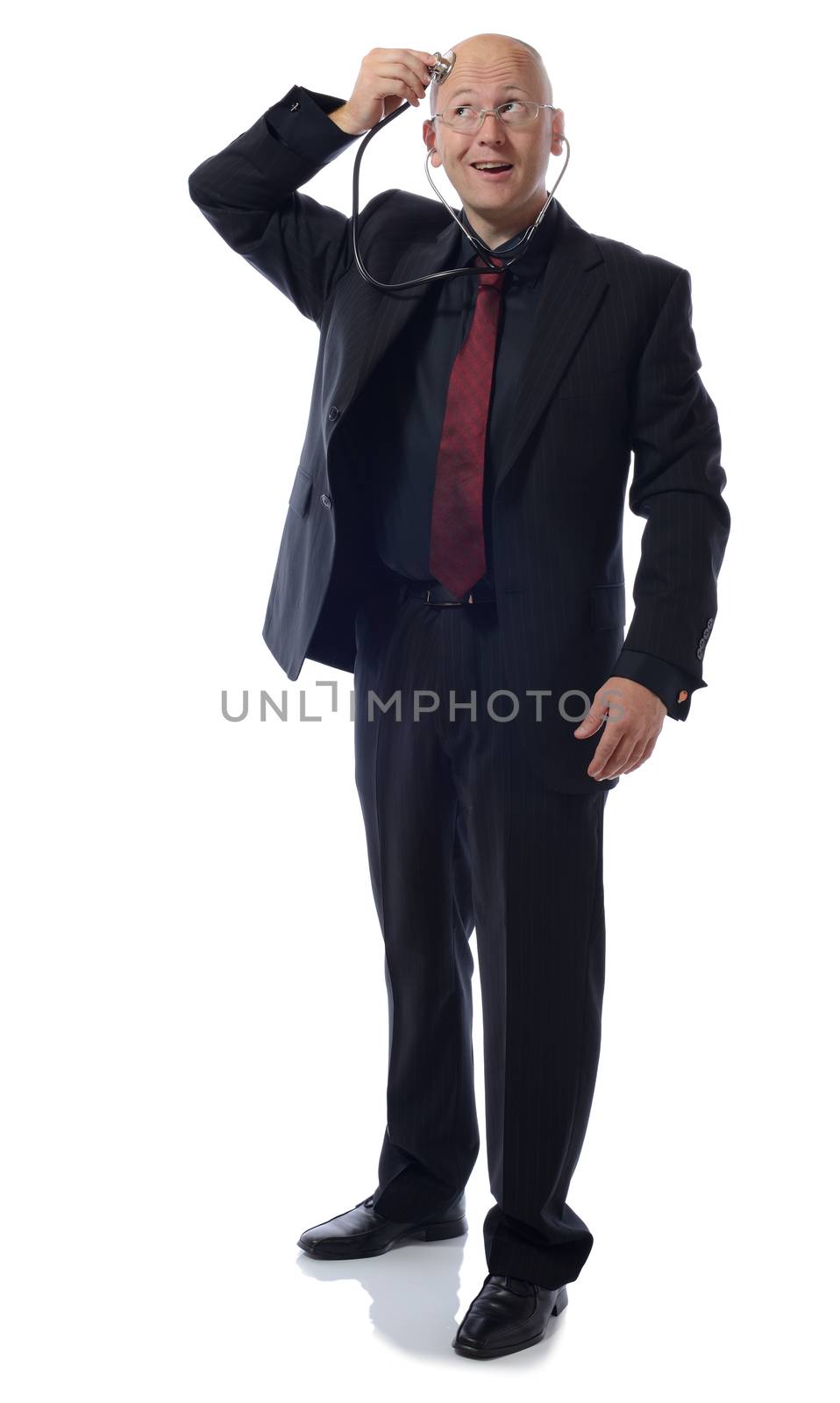 Man in a suit listening to his thoughts isolated on white