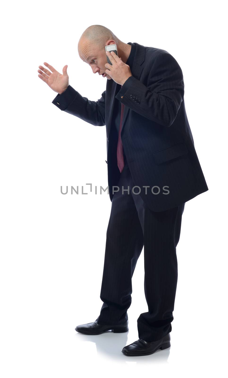 man on mobile phone getting shocking or bad news isolated on white background