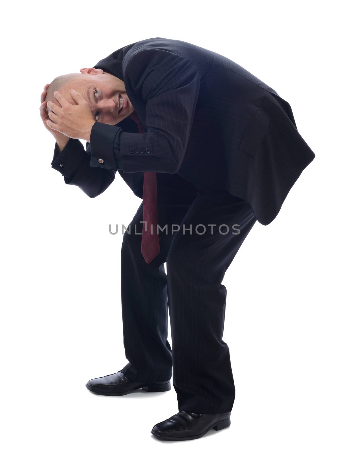 man in suit cowering isolated on white