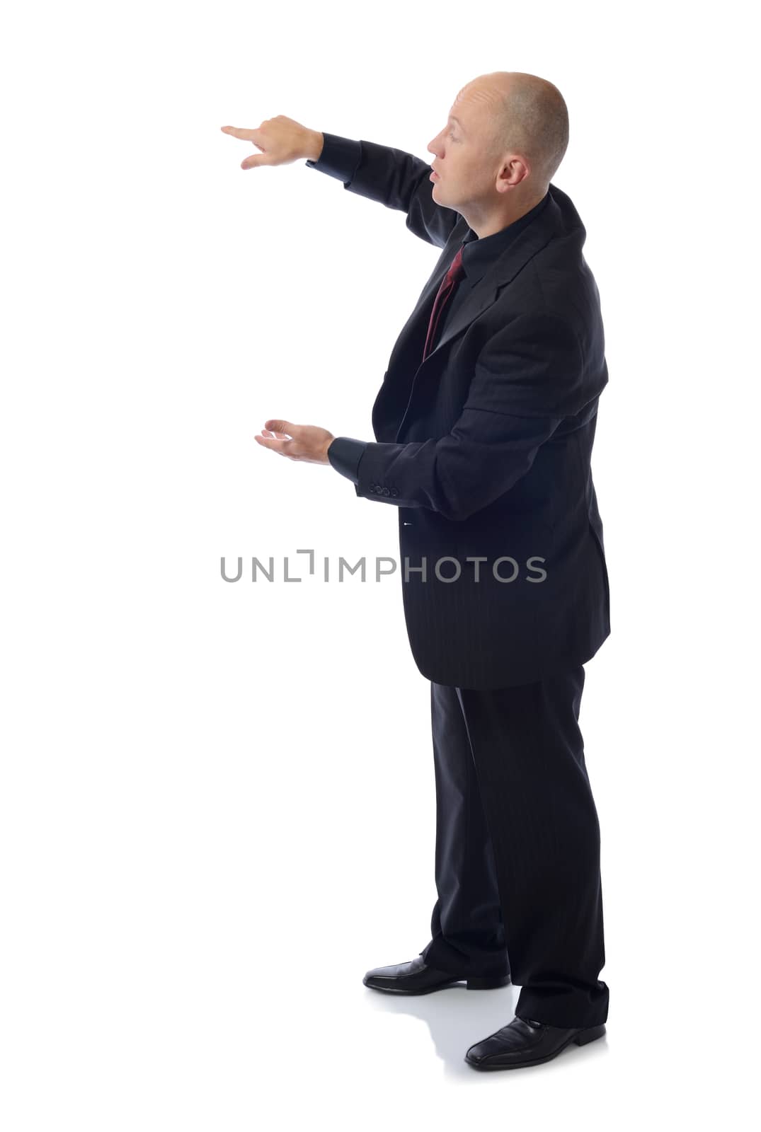 Full length of  male executive in suit presenting something over white background 