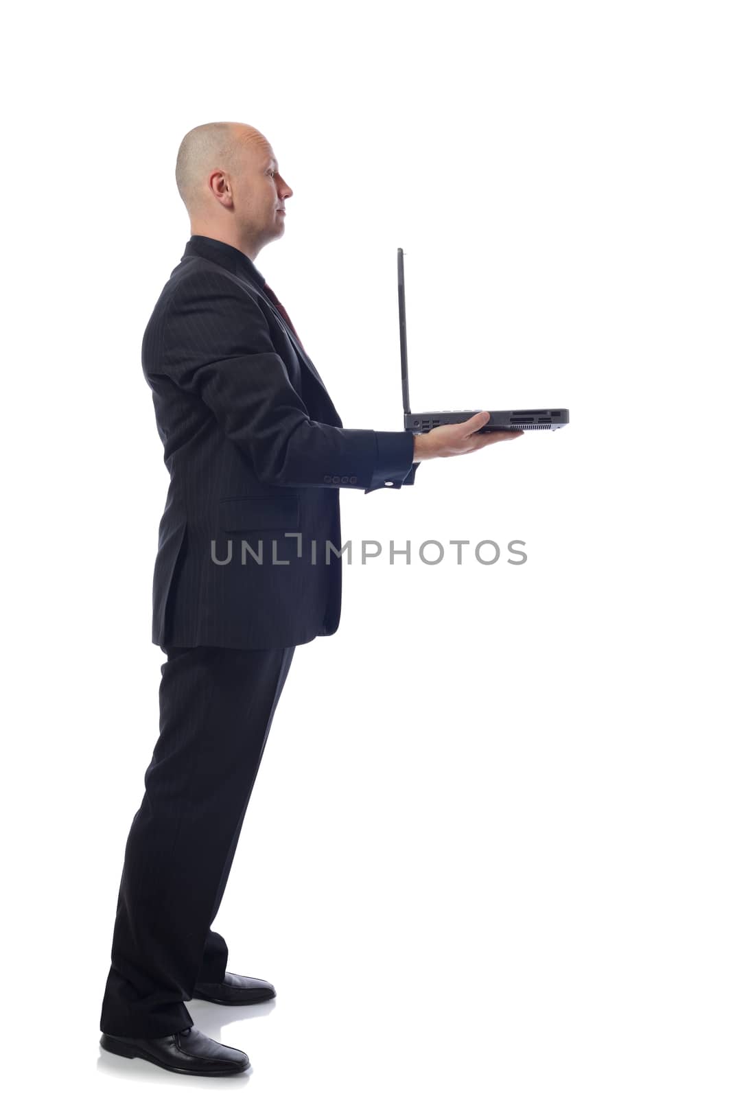 man presenting laptop in side view on white background 