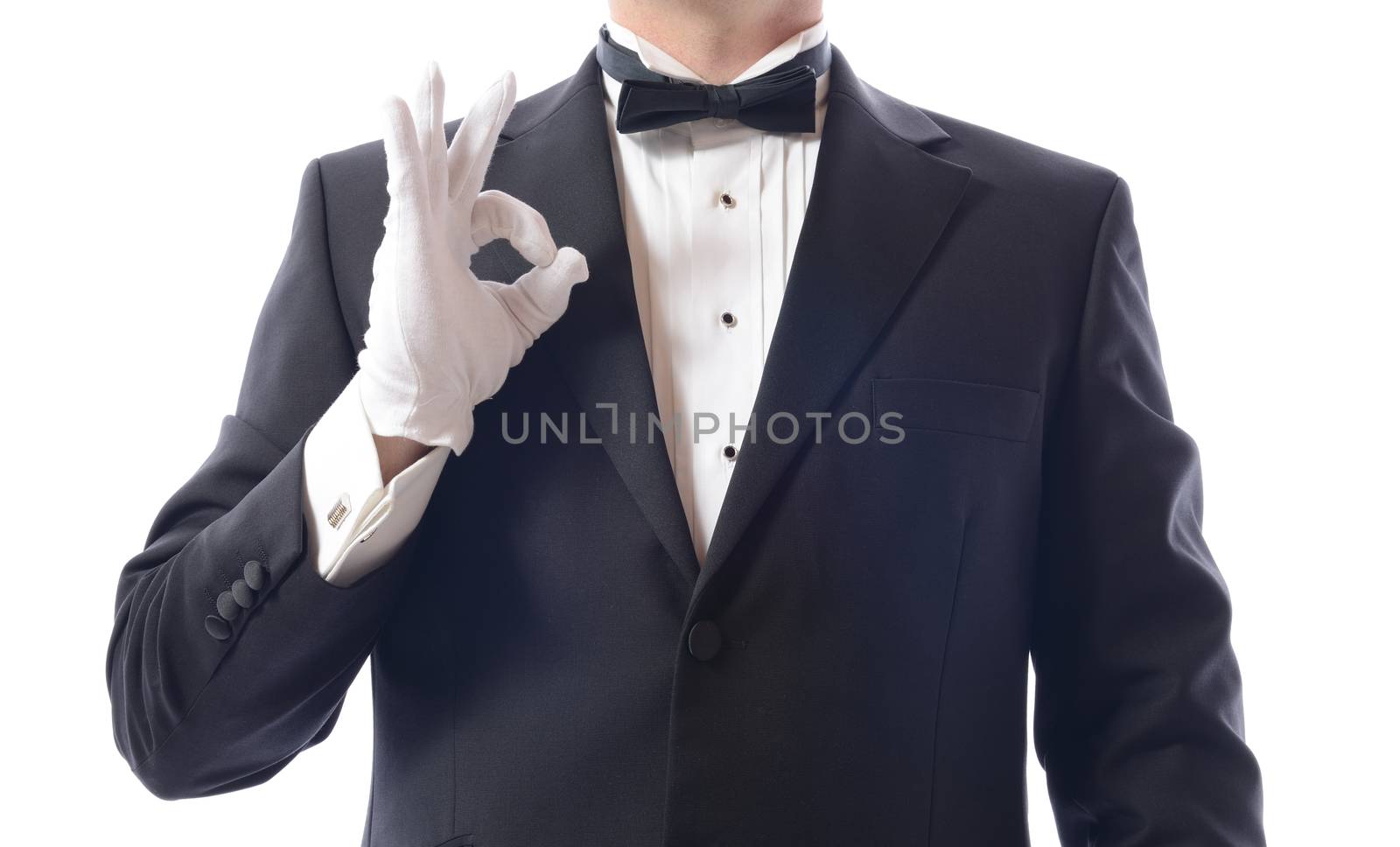 man in a tuxedo gesturing everything is ok isolated on white