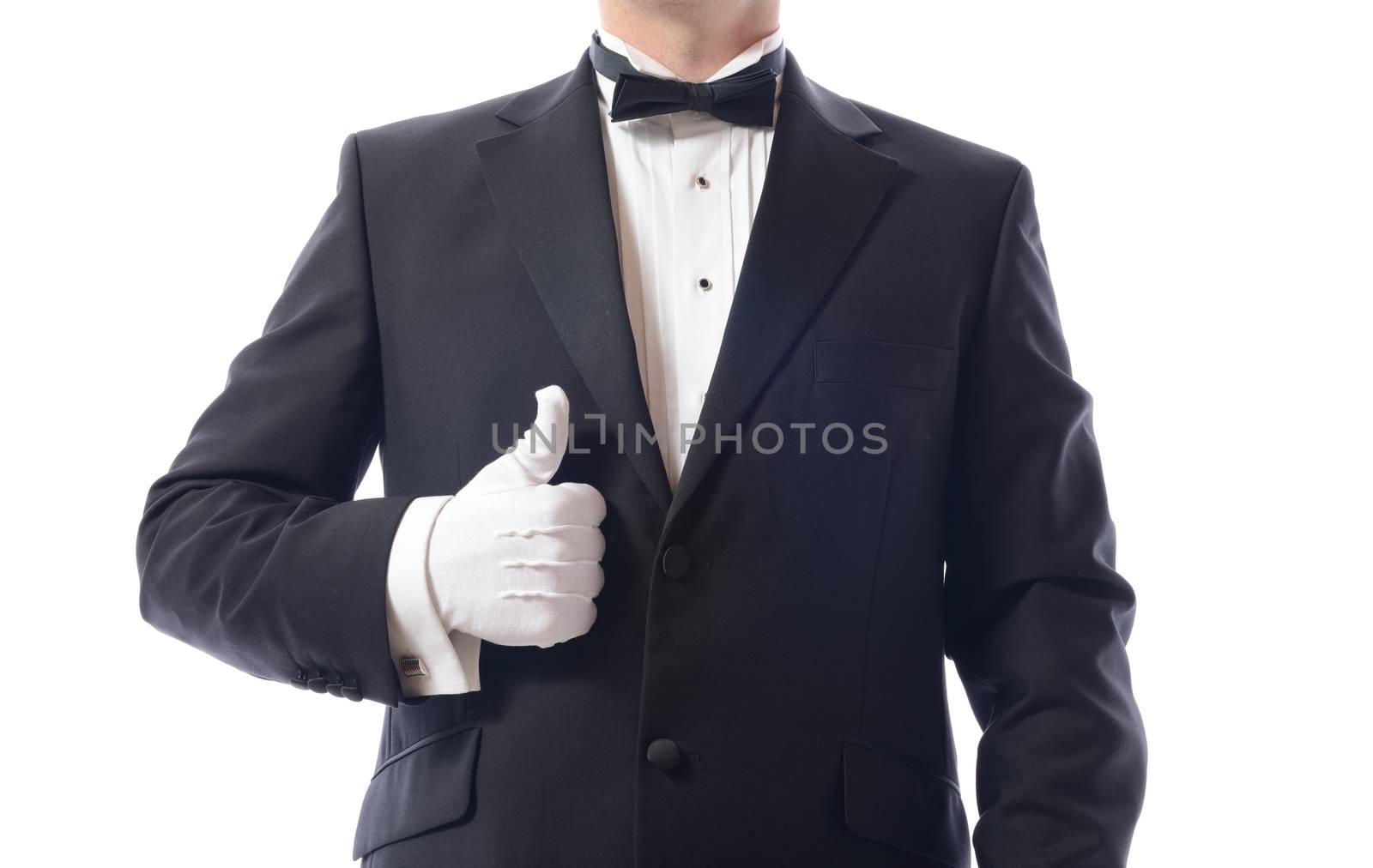 man in tuxedo giving the thumbs up isolated on white