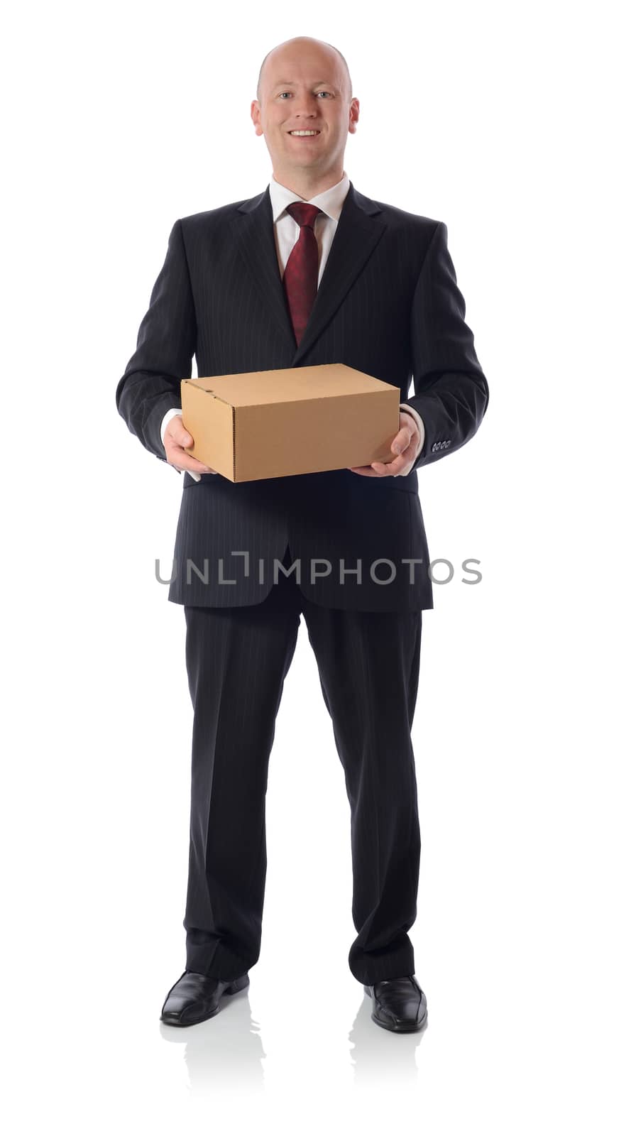 man in suit presenting a cardboard box parcel isolated on white