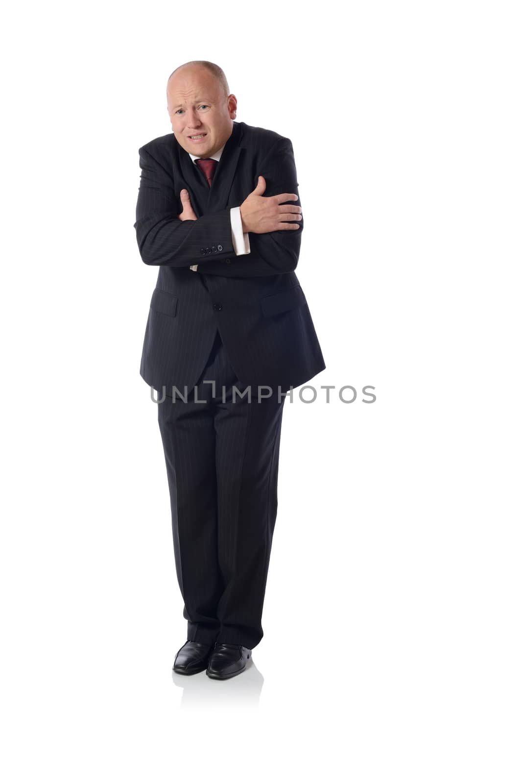 man in suit shivering from cols isolated on white