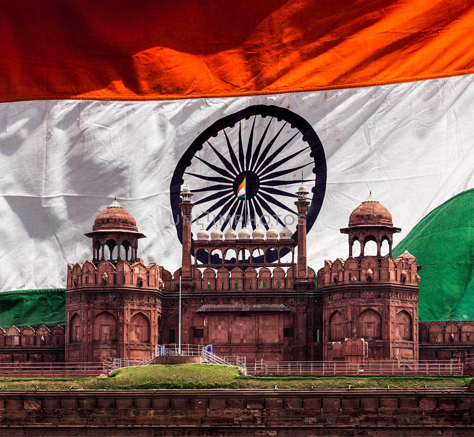 India travel national background - Red Fort (Lal Qila) Delhi against Indian national flag background. Delhi, India