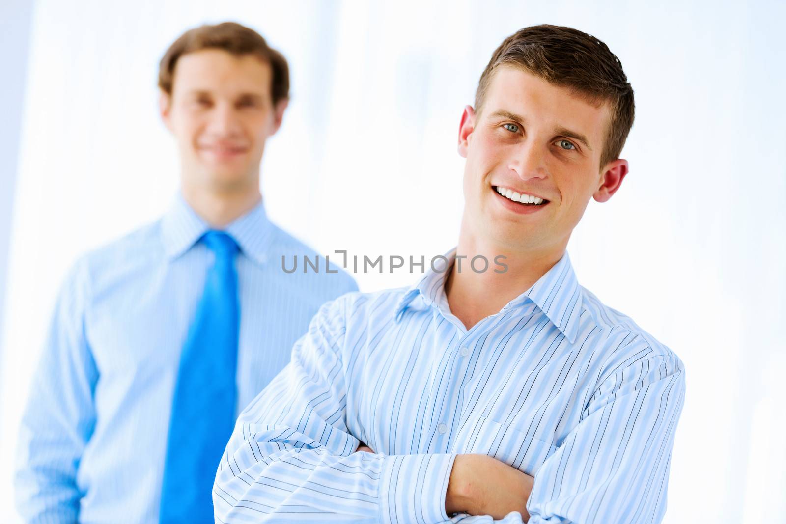 Image of successful young happy business persons