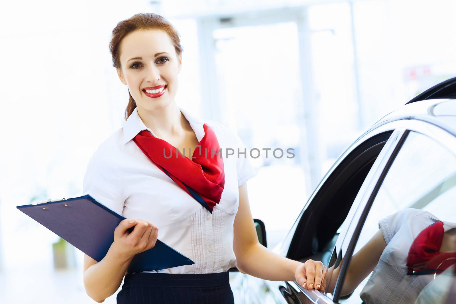 Woman consultant at car salon by sergey_nivens