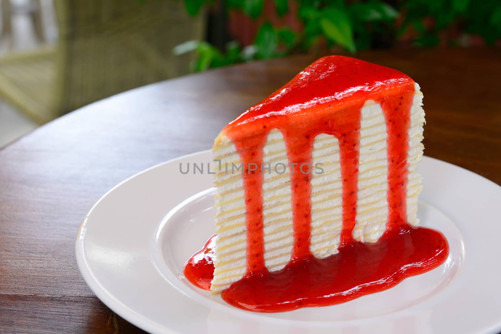 Homemade Crepe cake with strawberry sauce