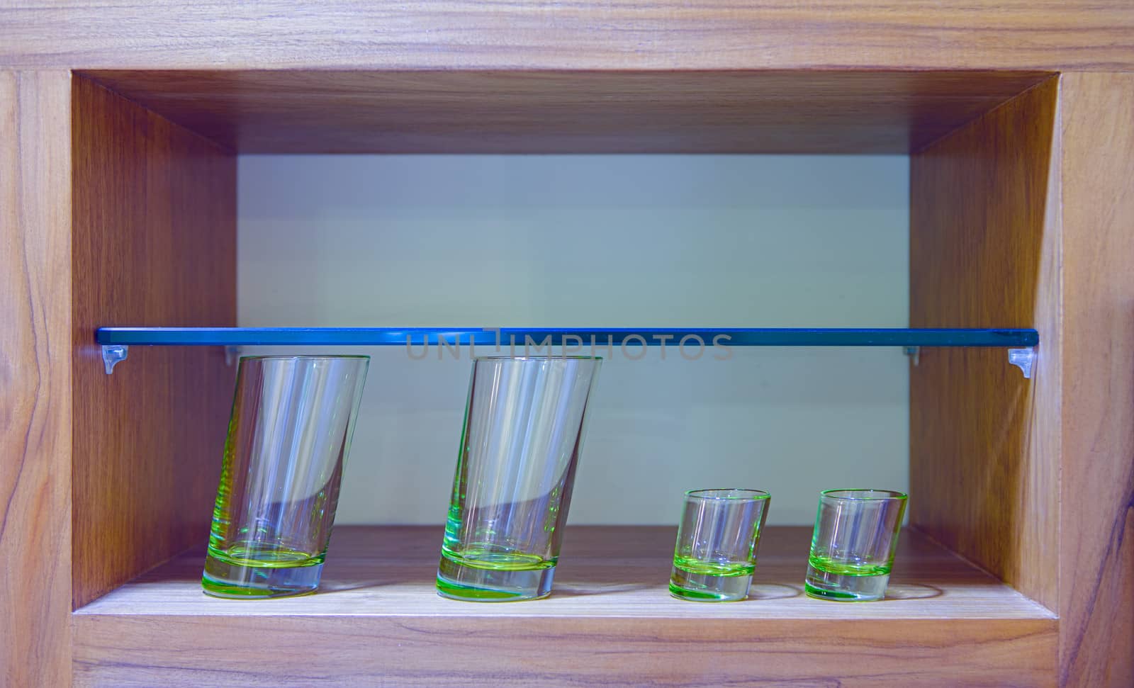 Four oblique glasses in wooden glass case