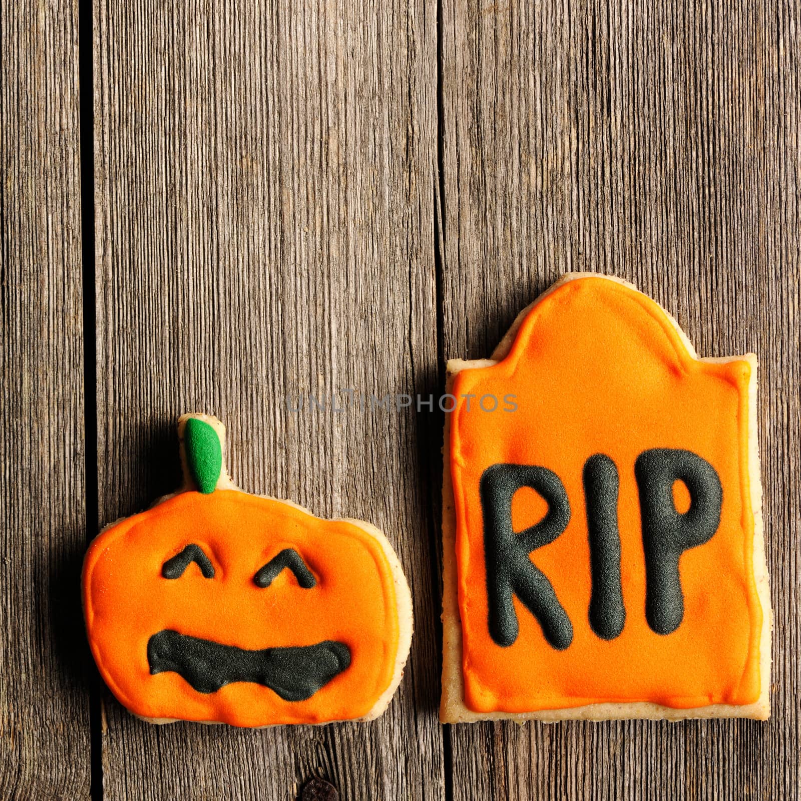 Halloween homemade gingerbread cookies over wooden table