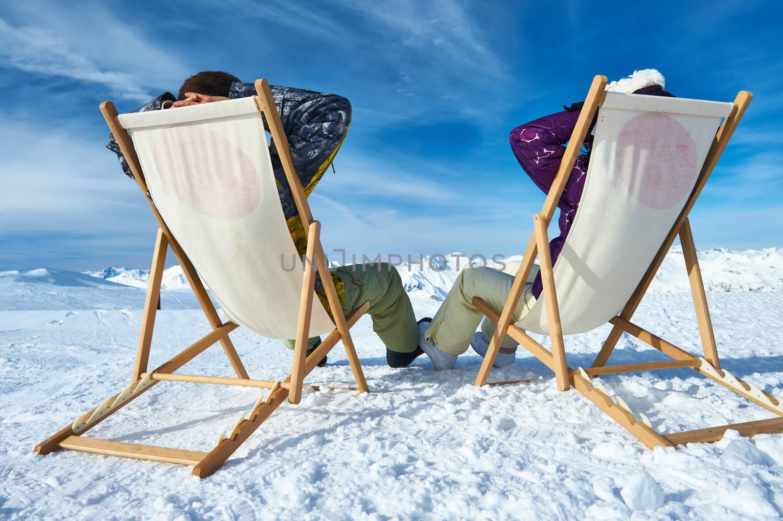 Couple at mountains in winter, Meribel, Alps, France