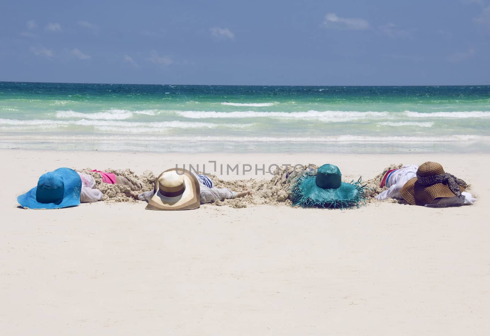 Girls with hats on a tropical beach by jelen80