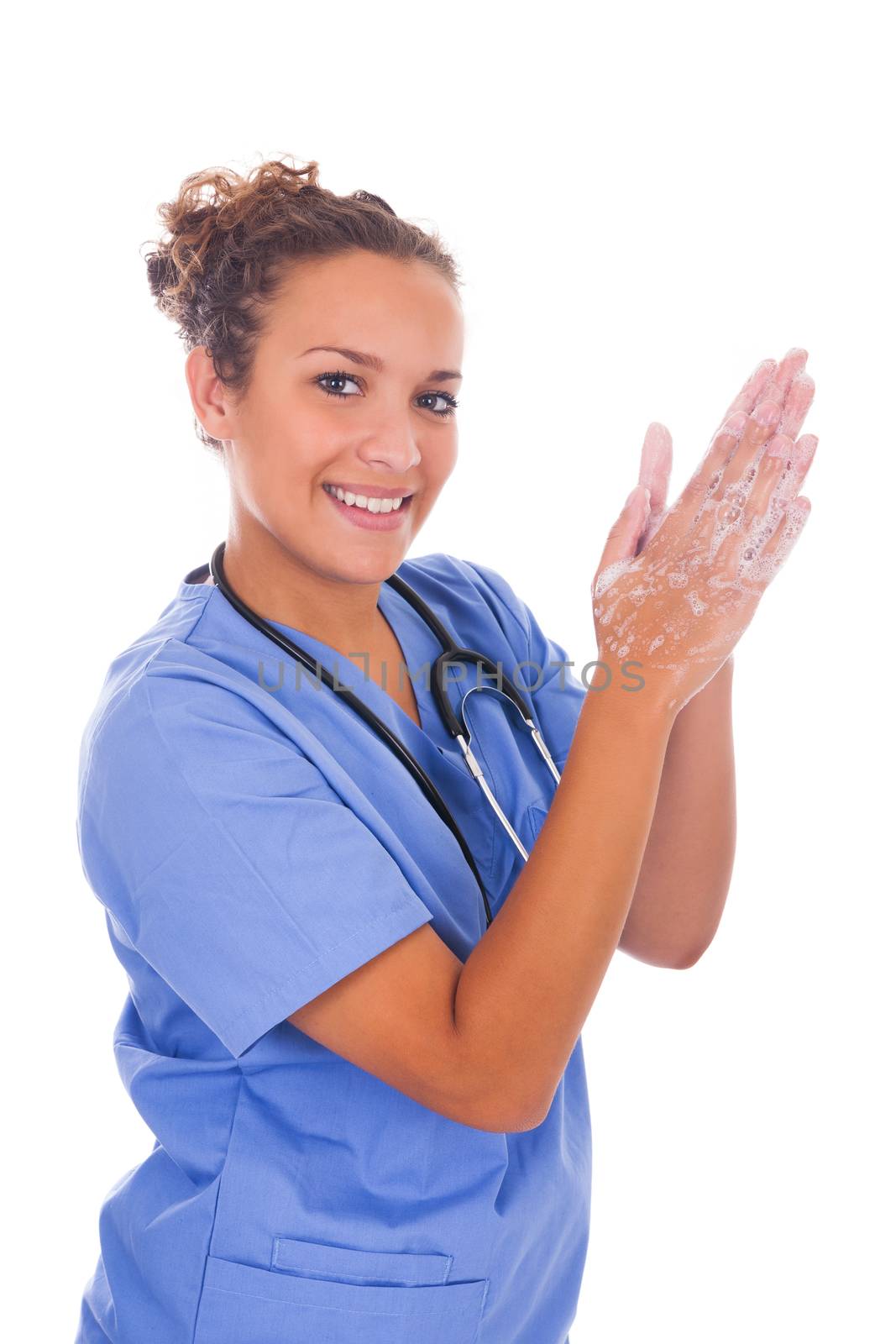 young nurse washing hands with soap by michel74100