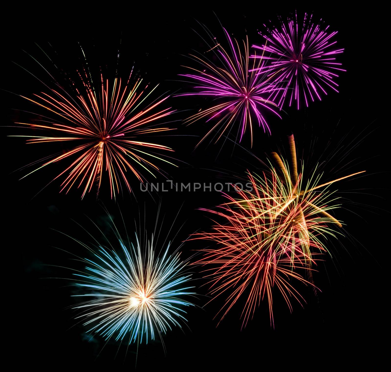 Multicolored fireworks display in a black night sky