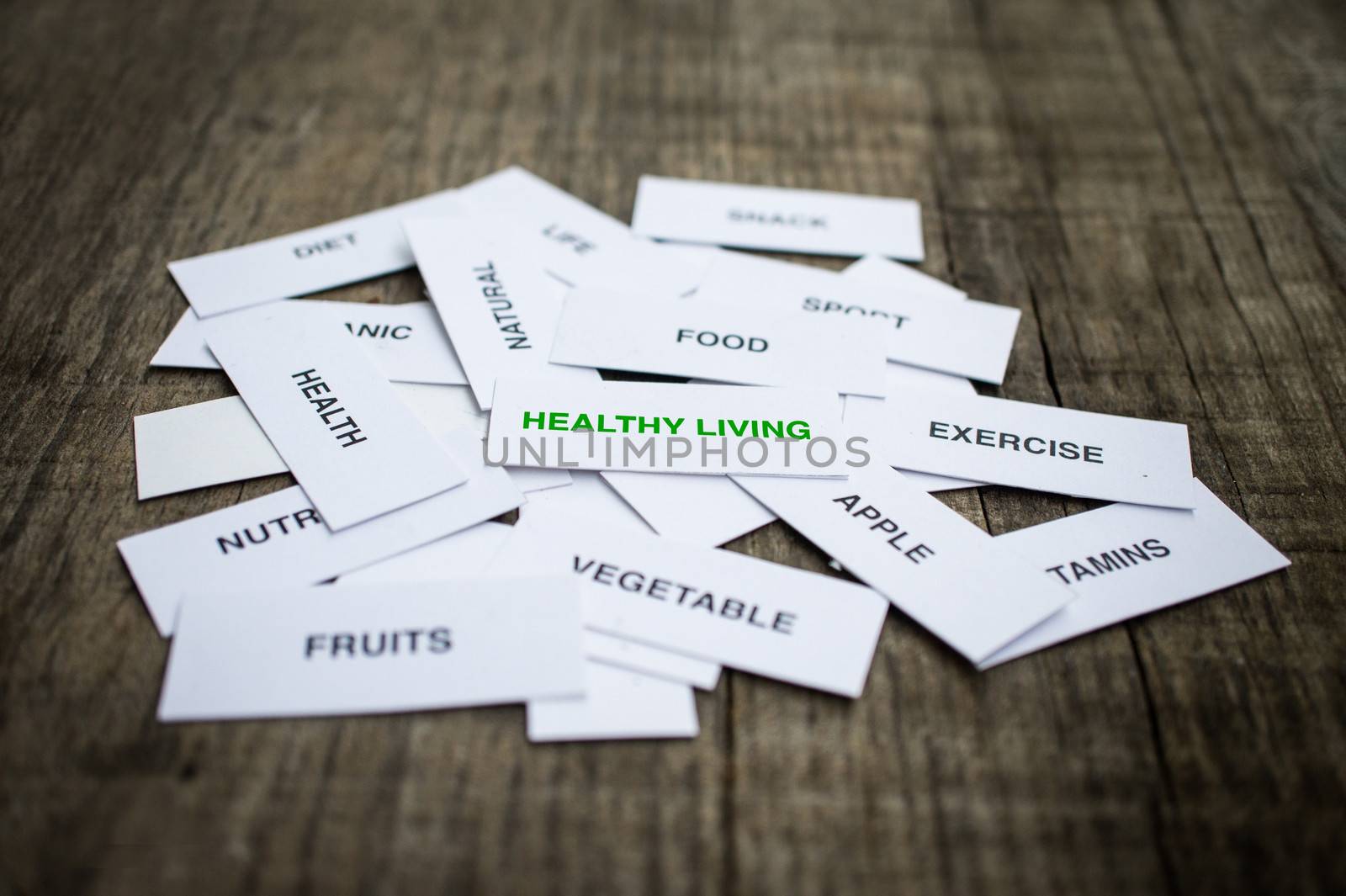 Paper strips with Healthy Living Concept related words on wooden background
