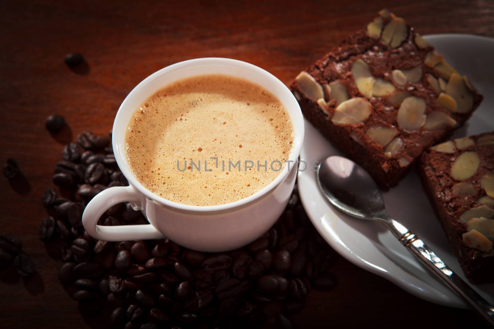 hot coffee on brownie cake on wood table for multipurpose