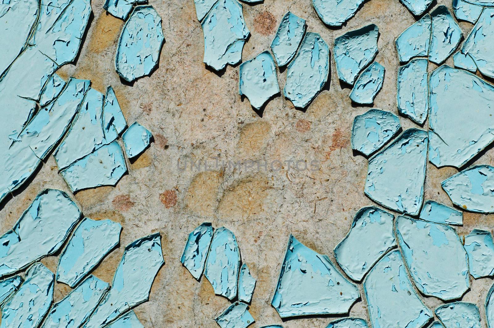 cracked surface of blue paint