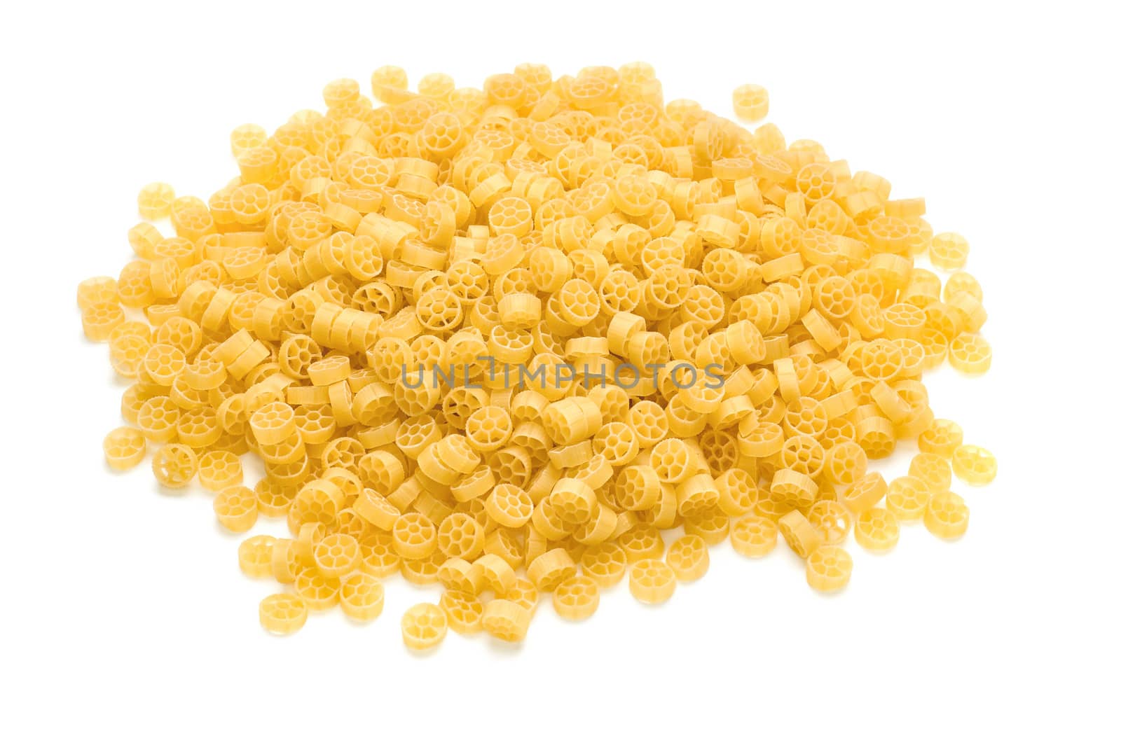 heap of raw pasta on the white background