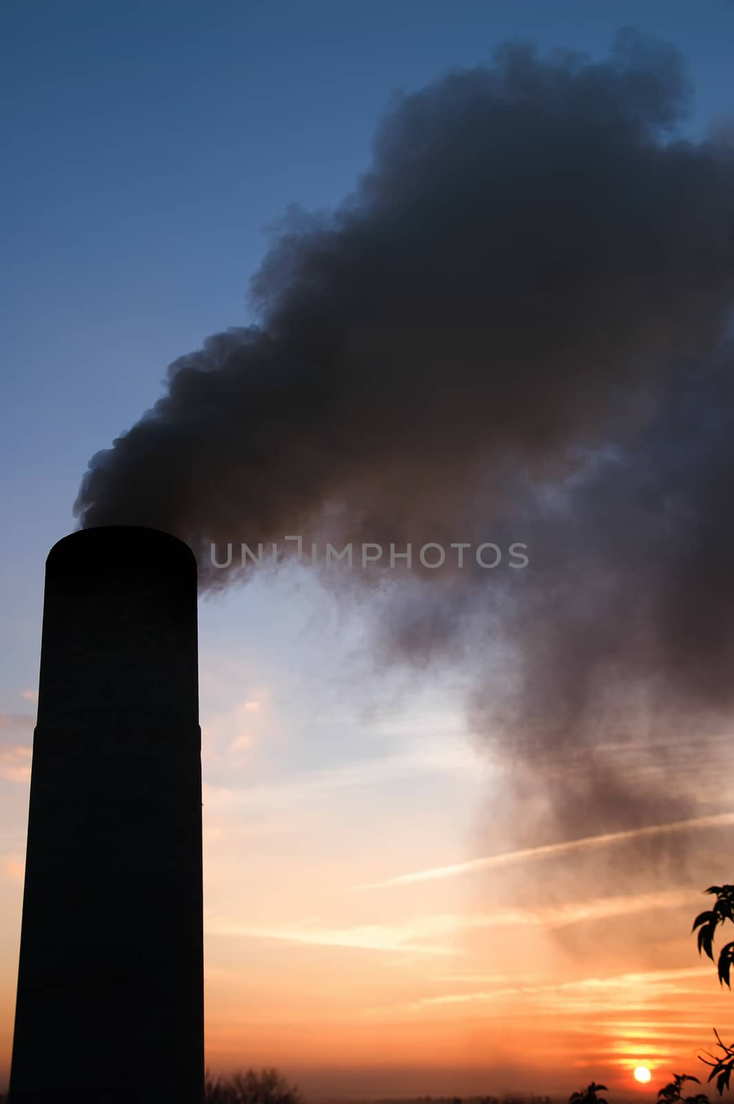 smokestack over sunset and blue sky by mycola