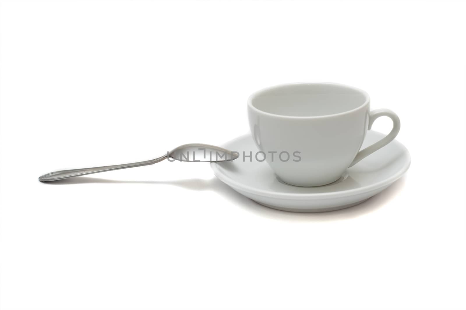 white cup with spoon and saucer isolated on white background