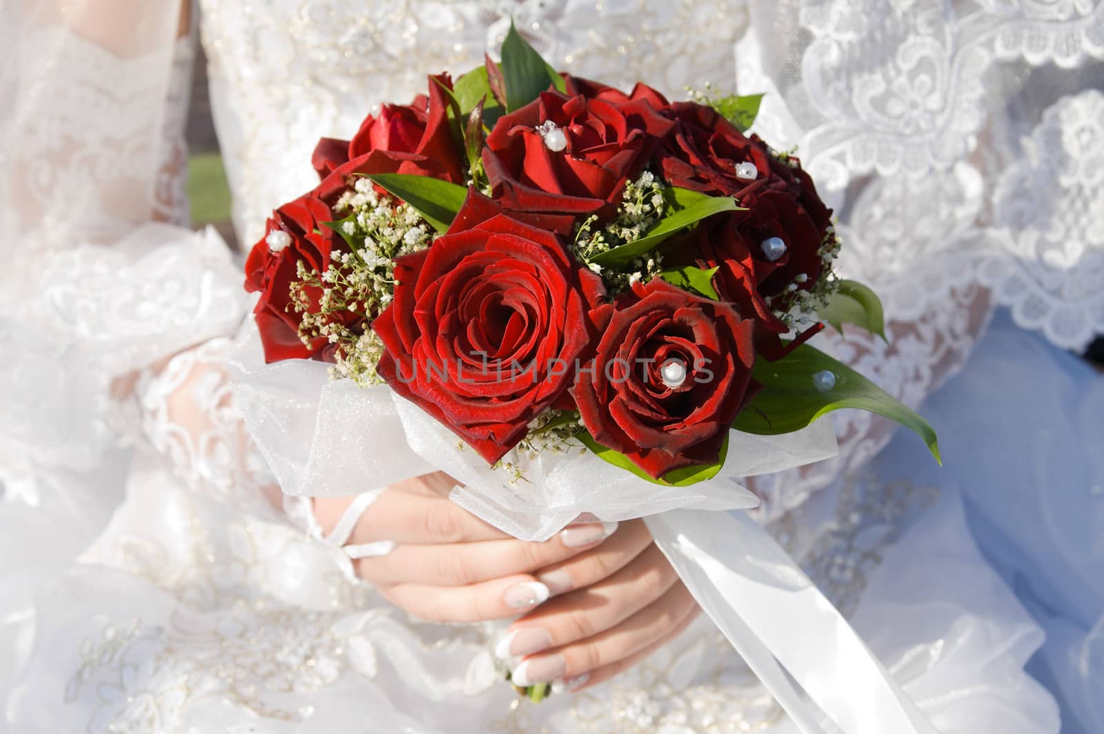 red roses bouquet in married woman's hand by mycola