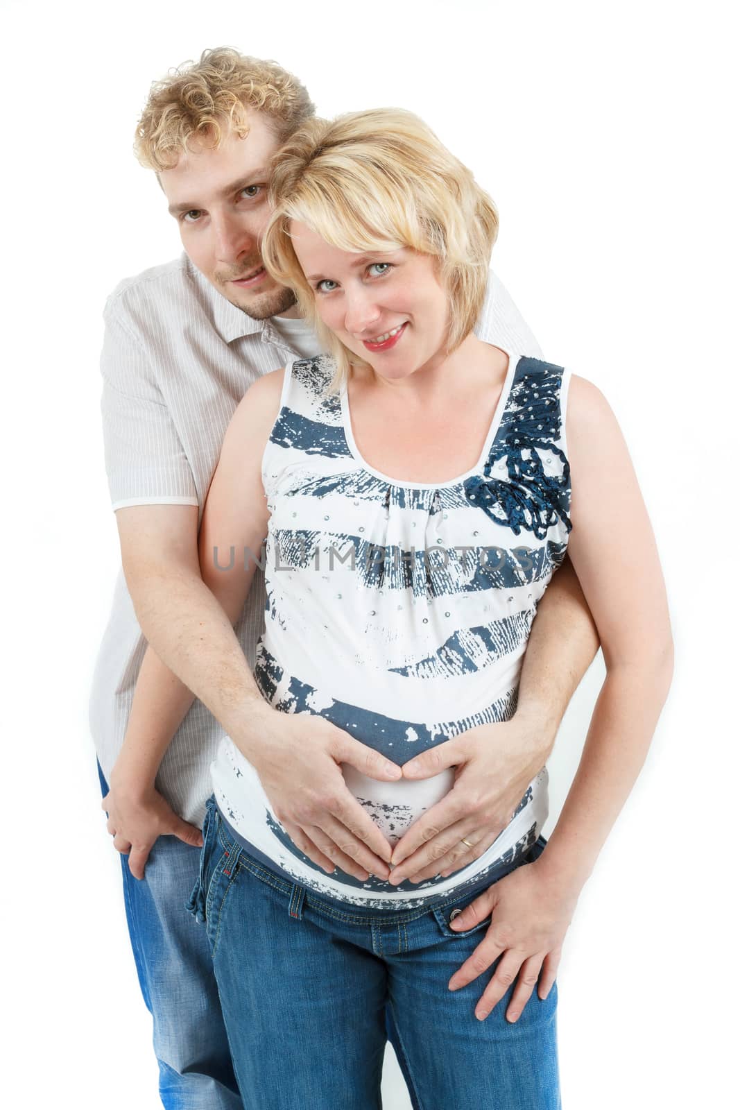 loving happy couple, pregnant woman with her husband, isolated on white background