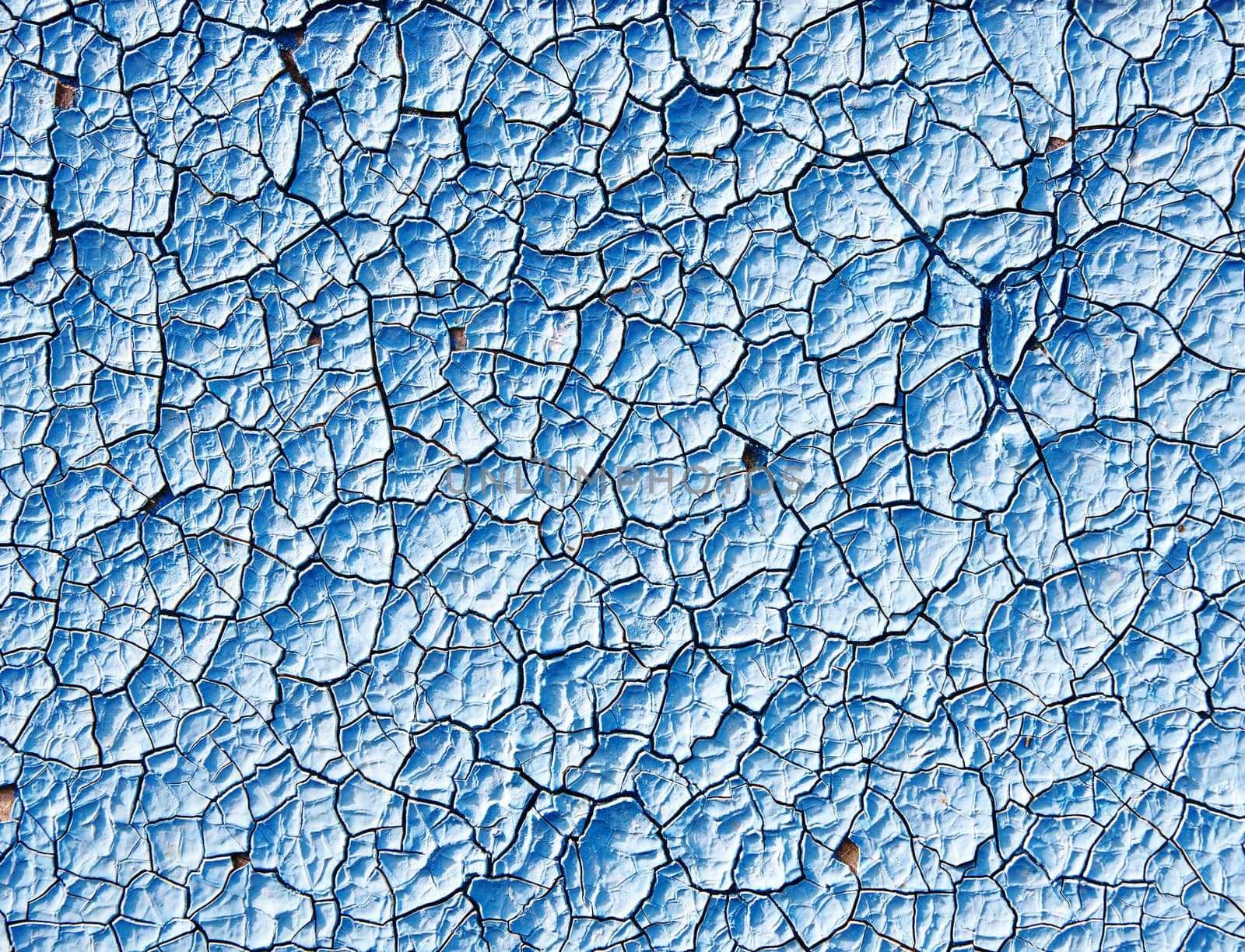 cracked blue paint surface as grunge background