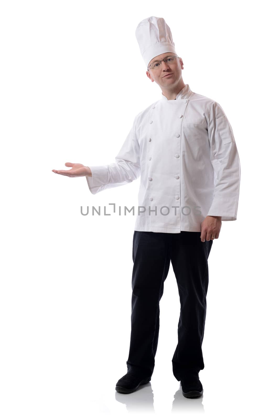 Male chef smiling pointing to a product isolated on white