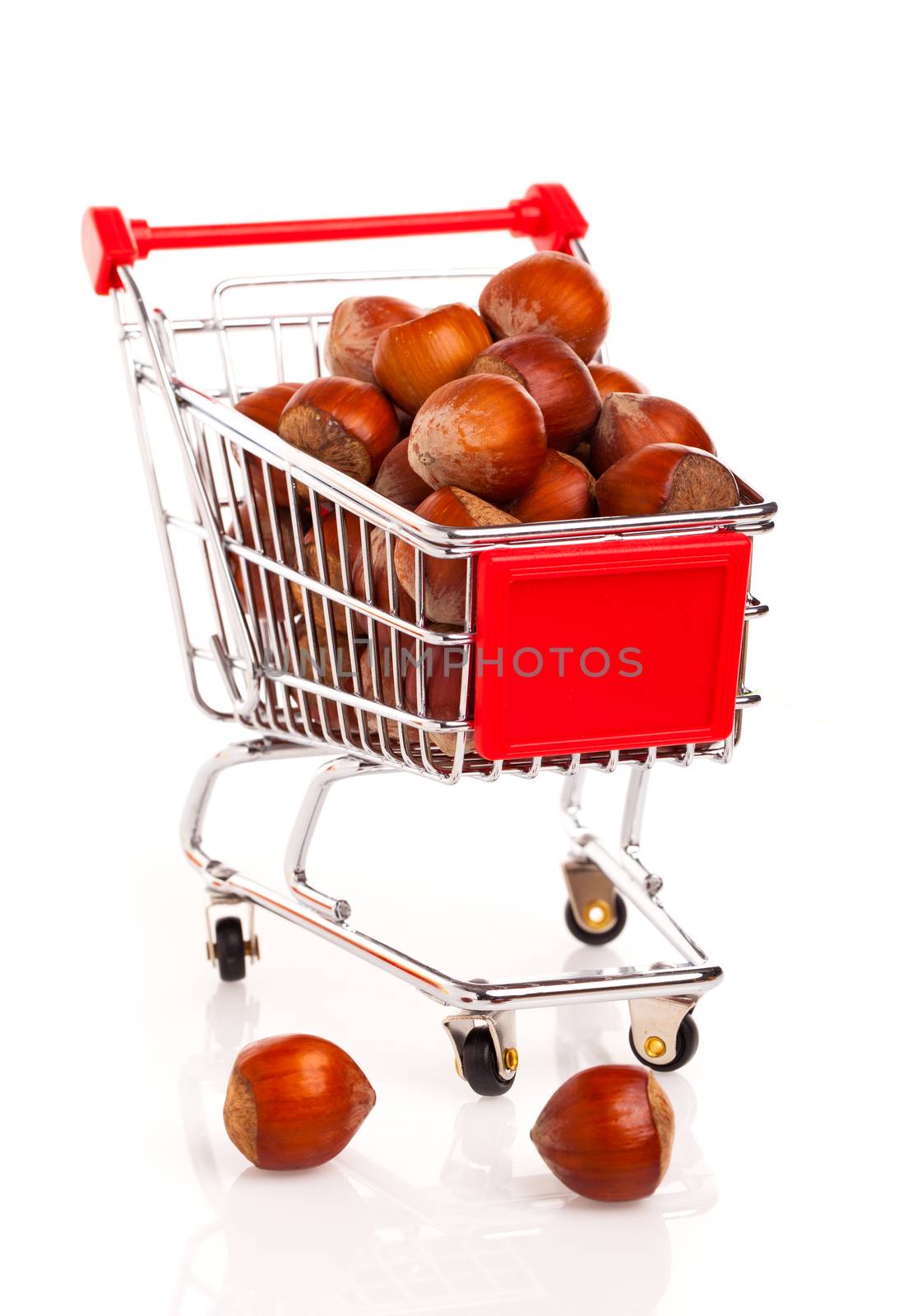 a Shopping cart full of hazelnut, on a white background