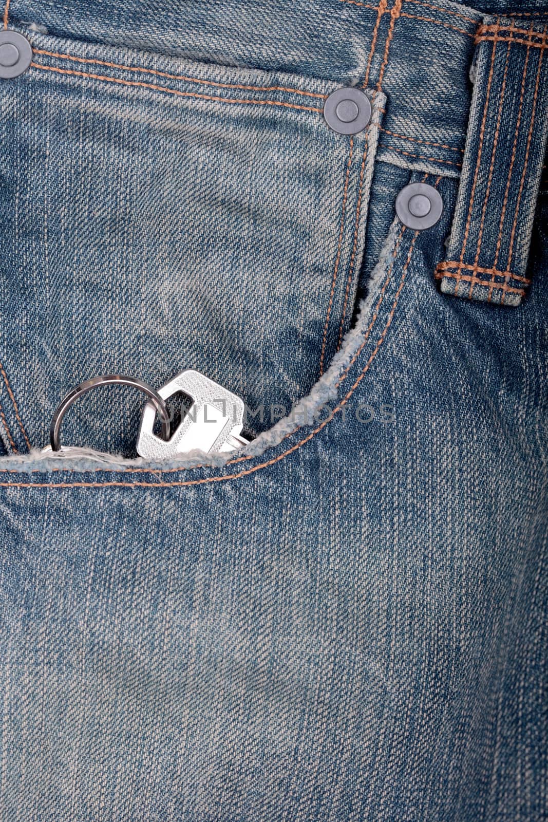 picture of a key inside  a pocket of a jeans