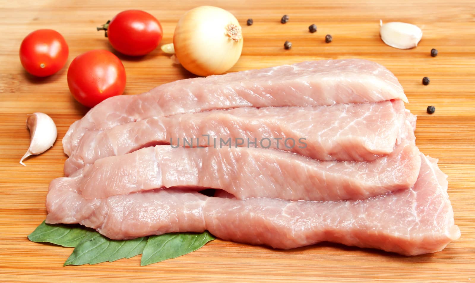Raw pork with spices and vegetables
