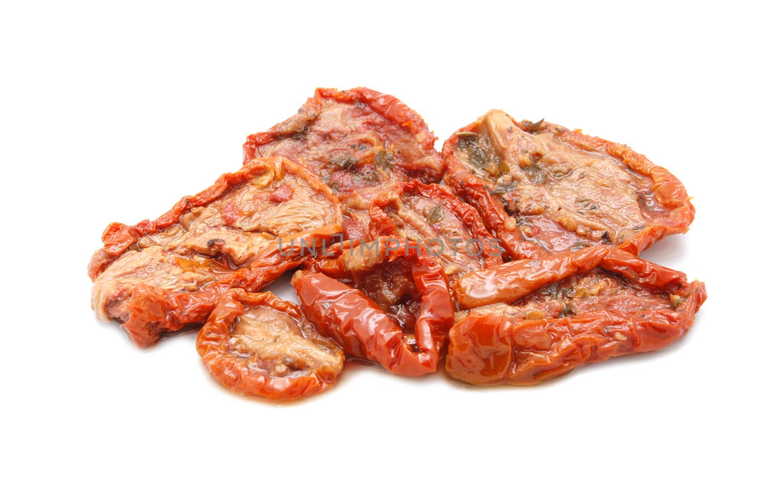 Sun-dried tomatoes in oil, isolated on a white background