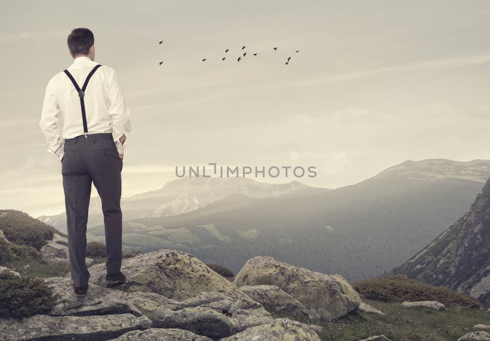 Man with hands in his pocket looking at view.Relaxing concept