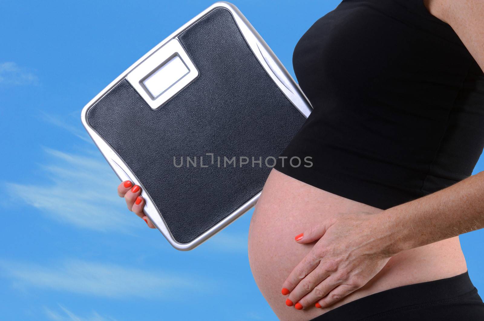 scale and weight gain during pregnancy concept
