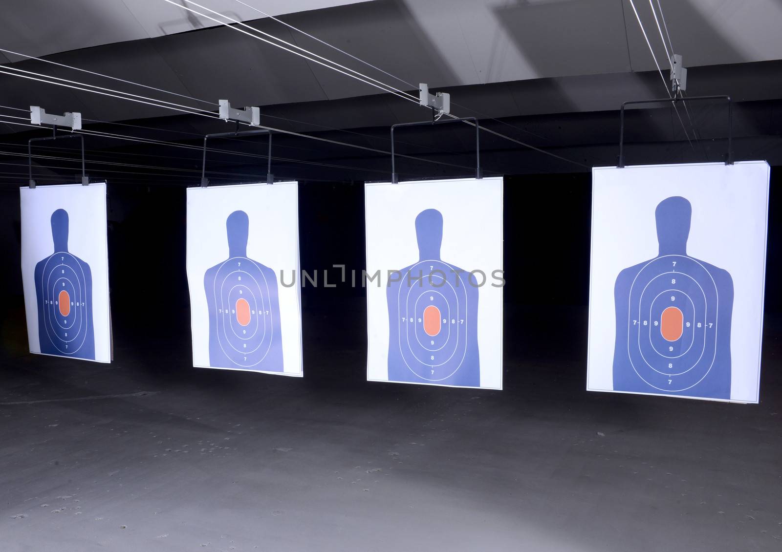 bullseye targets lined up at gun range