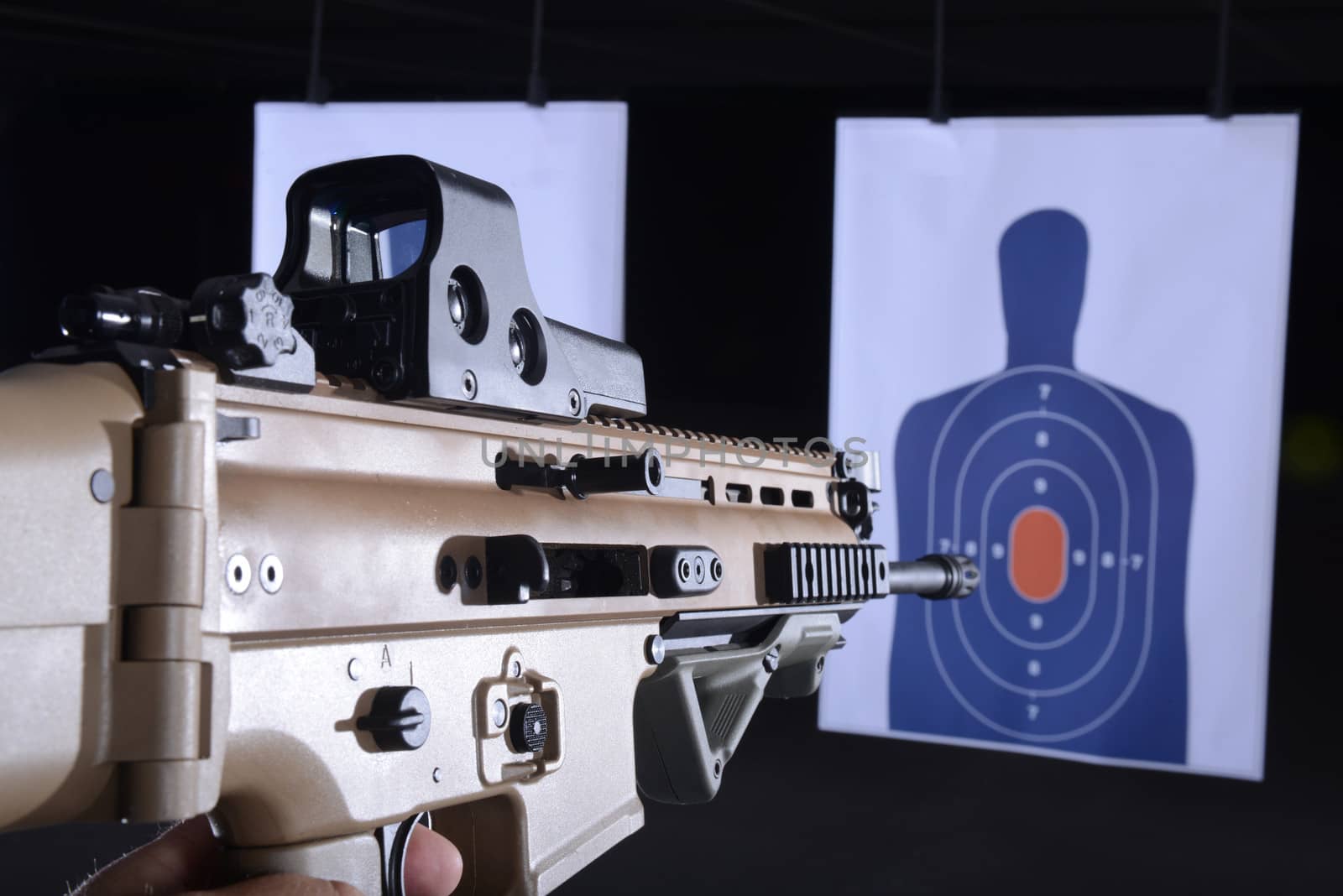 machine gun pointed at bullseye target on gun range by ftlaudgirl