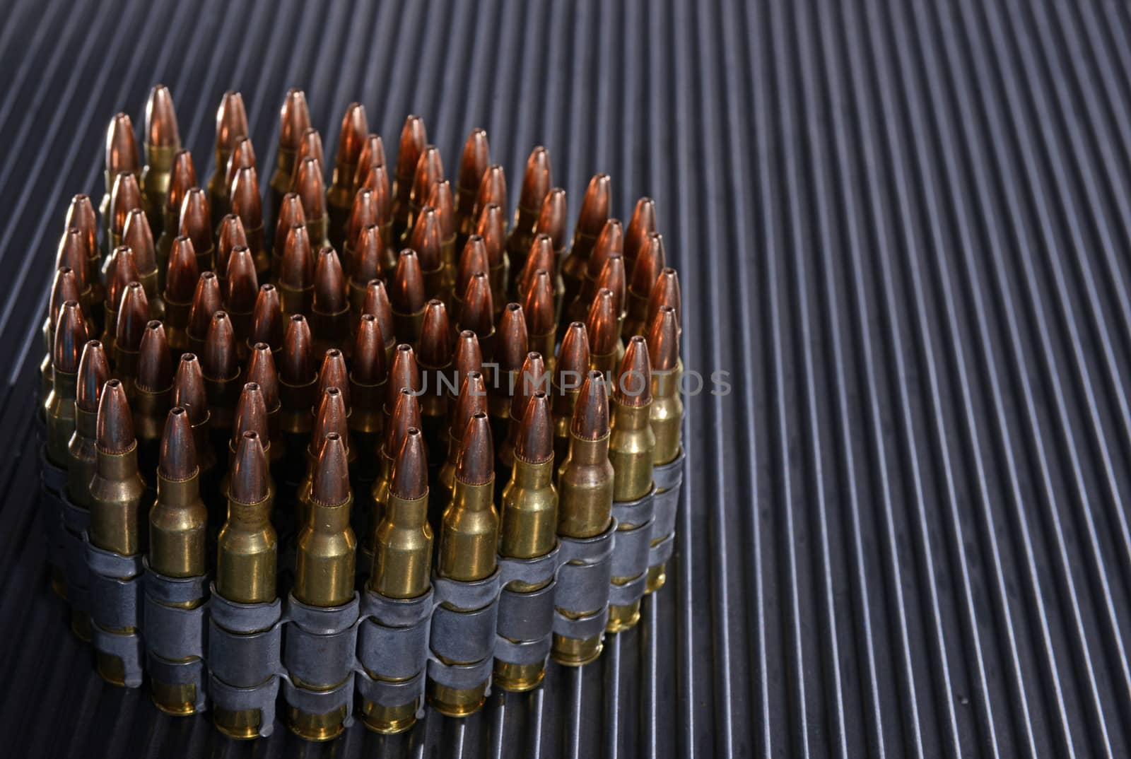 rifle bullets or ammunition on textured background