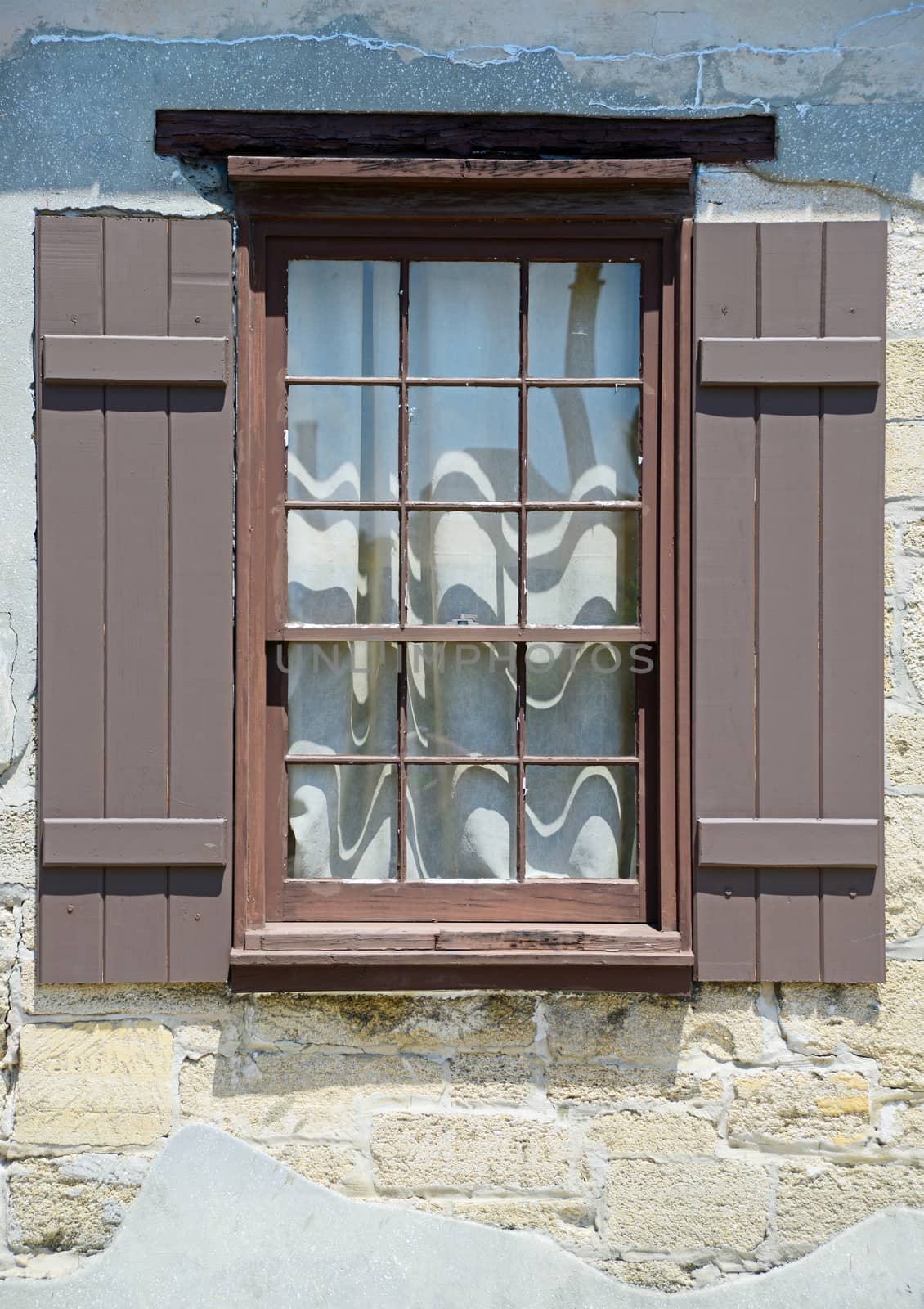 window with shutters in medieval european village by ftlaudgirl