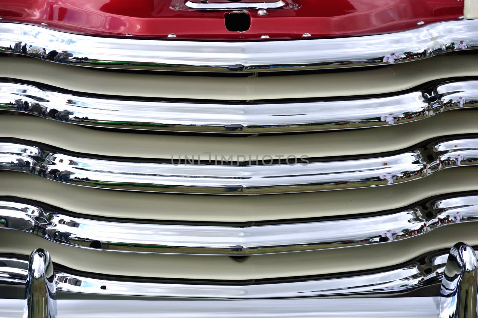 Close up of car radiator grill with red