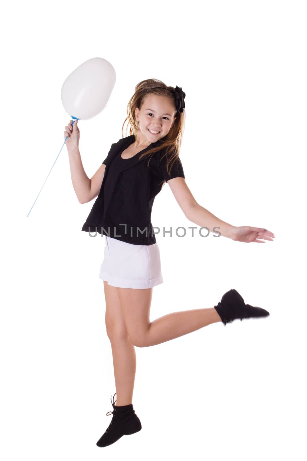 Happy girl jumping with balloon isolated on white, in motion