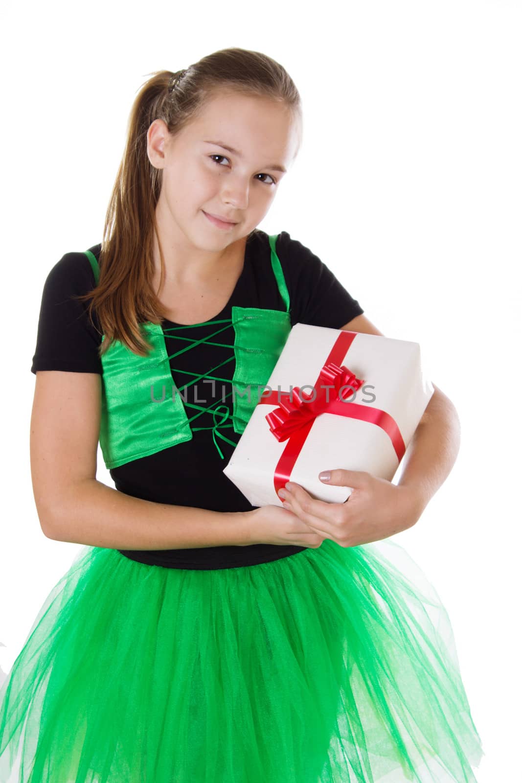 Little dancer in green tutu with present box isolated on white