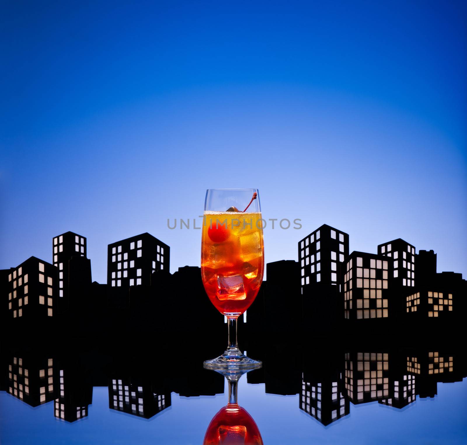 Metropolis Tequila Sunrise cocktail in city skyline setting